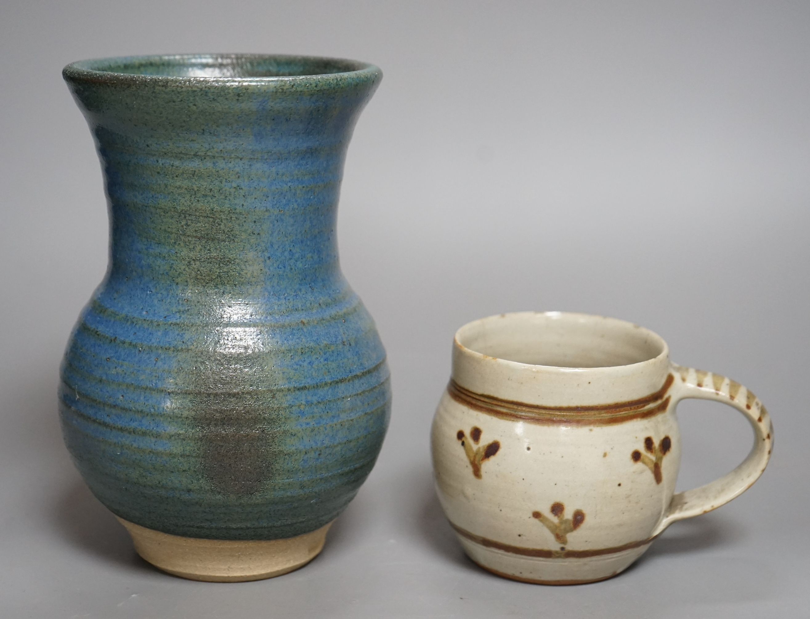 An Accolay style blue glazed stripe vase, together with a Wenford Bridge stoneware mug, both with impressed marks, tallest 19cm, (2)